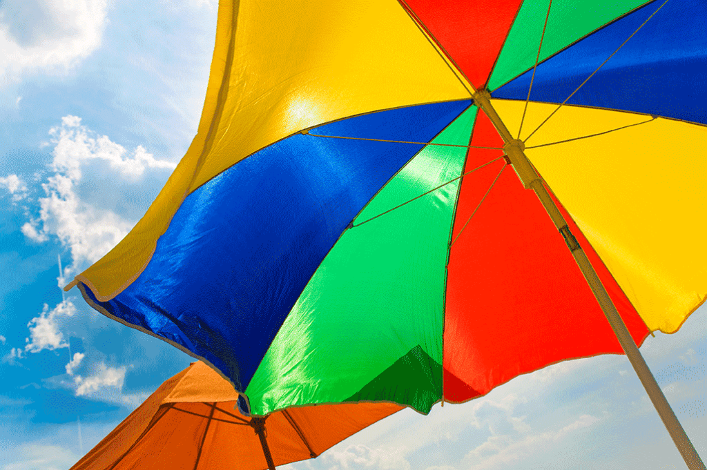 Photograph of a beach umbrella under a clear sunny sky