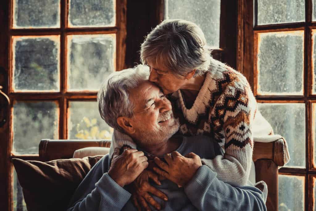 Senior man and woman embracing